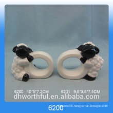 Simple ceramic paper napkin ring with lamb figurine